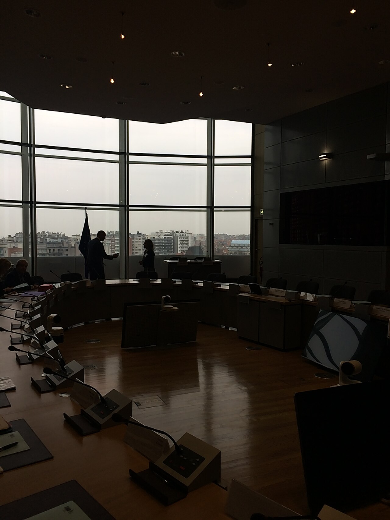 A quiet conference room with a long table and chairs